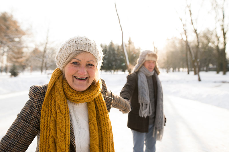 seniors outdoors in snow photo